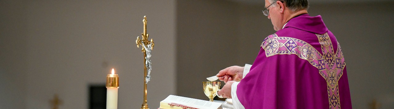 A priest celebrating the Mass at St. Peter Chanel Catholic Church