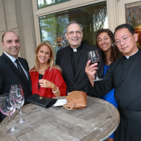 OMV Annual Gala group standing around table