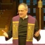 Fr. Peter Grover speaking at Mass during Advent