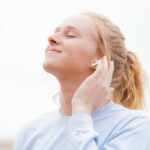 Woman listening to headphones