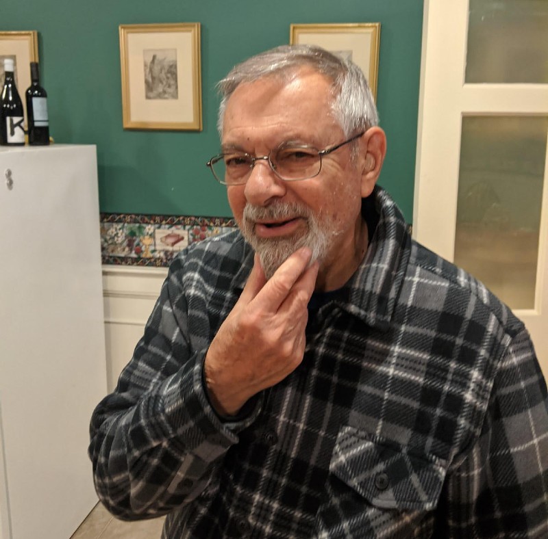 Br. Lou stroking his chin in a thinking pose