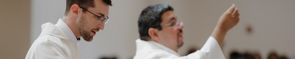 Fr. Jonathon Hank and Fr. Jorge Sanchez offer the Body of Christ at Communion