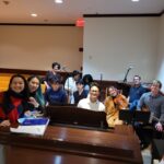 Celine Wynn pictured with the St. Francis choir and musicians